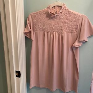 Perfect for work! Gathered top with short sleeves. Never worn.